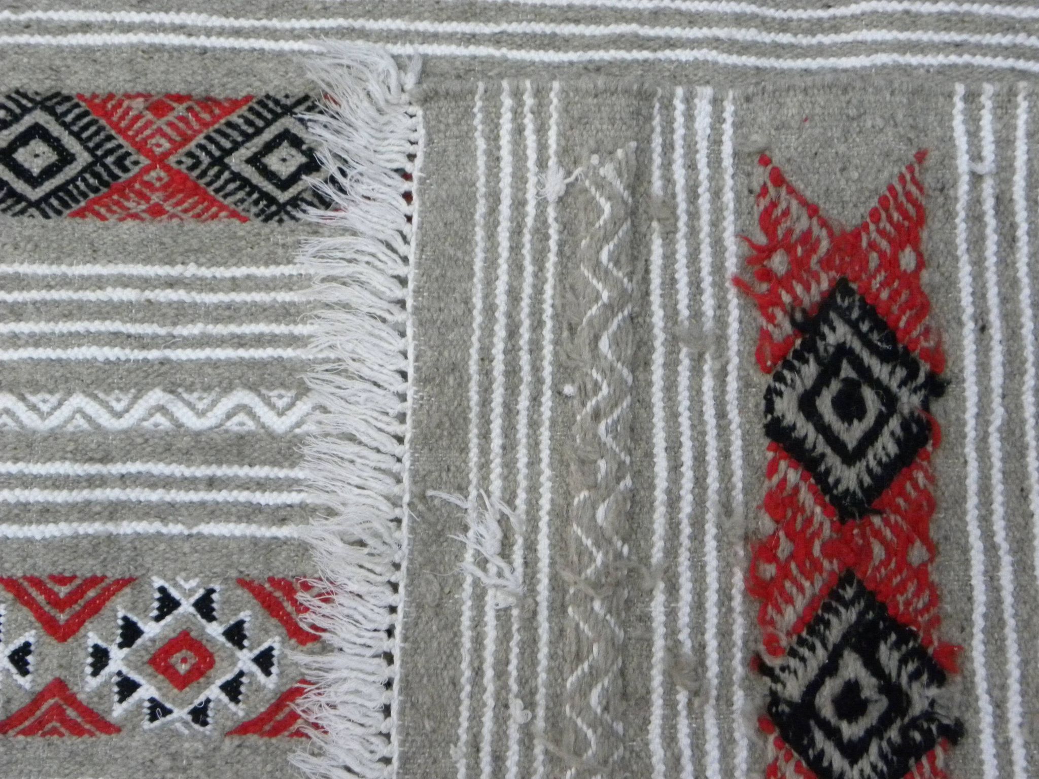 Geometric woven rug with fringes – Ethnic style – Hallway & interior