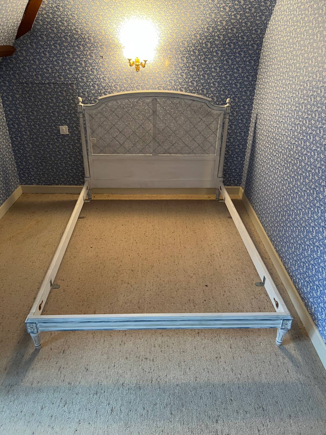 White wooden cane bed