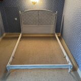 White wooden cane bed