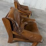 Armchairs in leather and vintage wood 70's