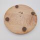 Under wooden dish