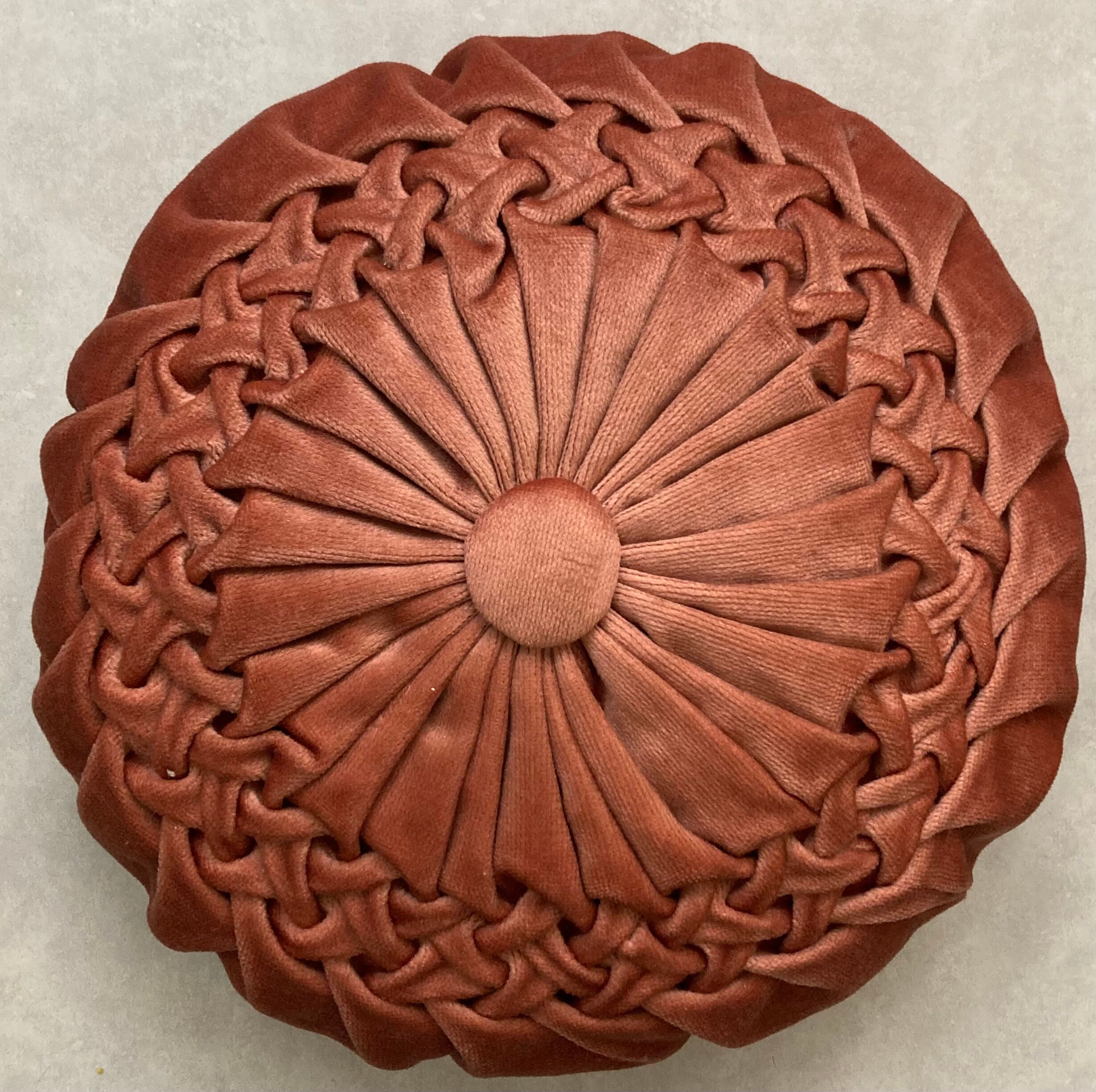 Pair of round vintage pleated velvet cushions