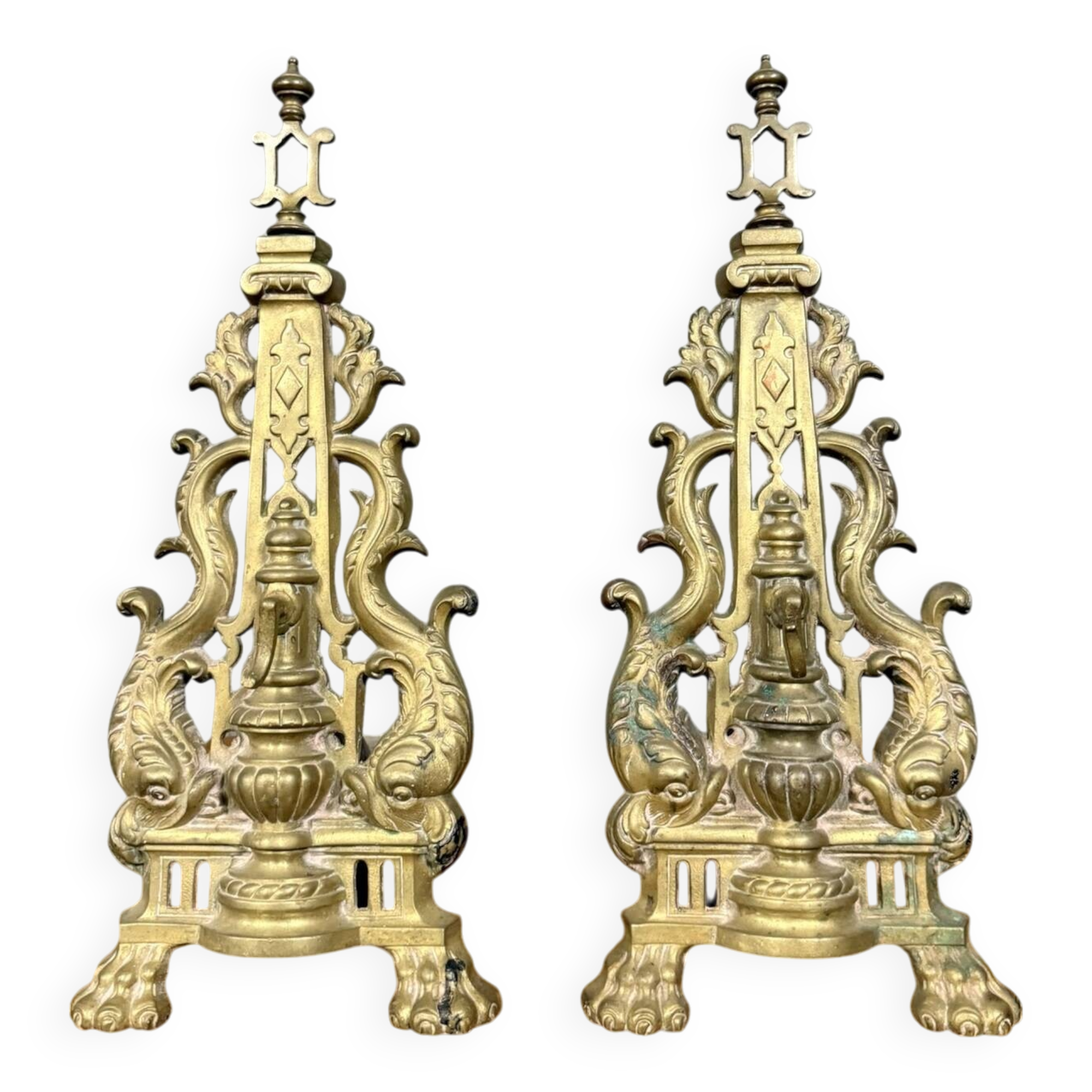 pair of Empire period dolphin firedogs in gilded bronze