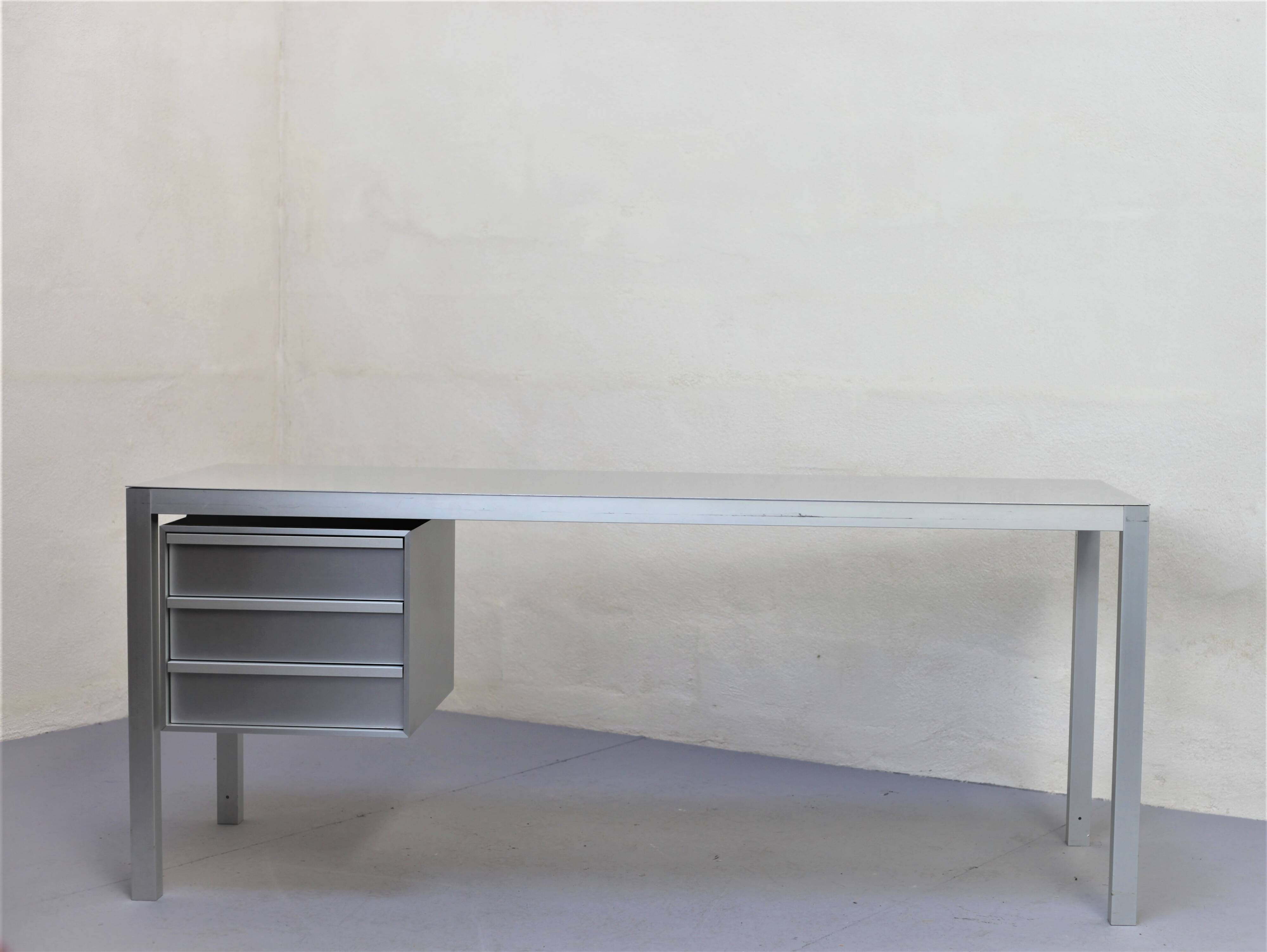 Brushed aluminum desk by MDF Italia