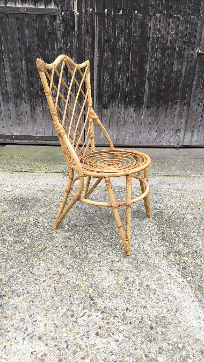 Rattan chair by Louis Sognot 1960
