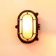 Antique Holophane wall lamp in patinated bronze