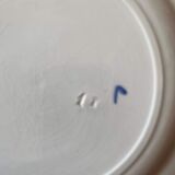 7 hand-painted flowered dinner plates.