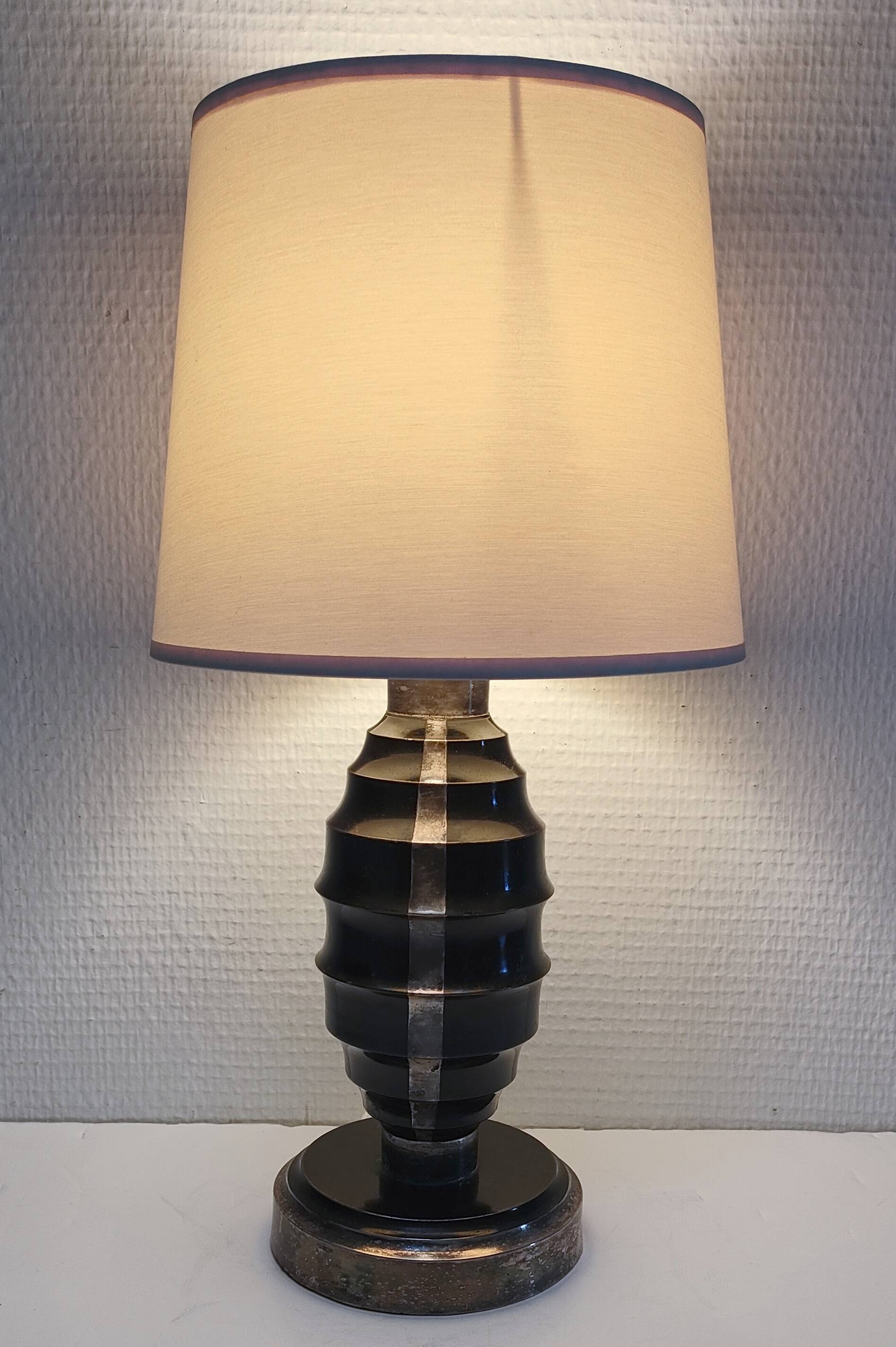 Art Deco metal lamp base with black and silver patina