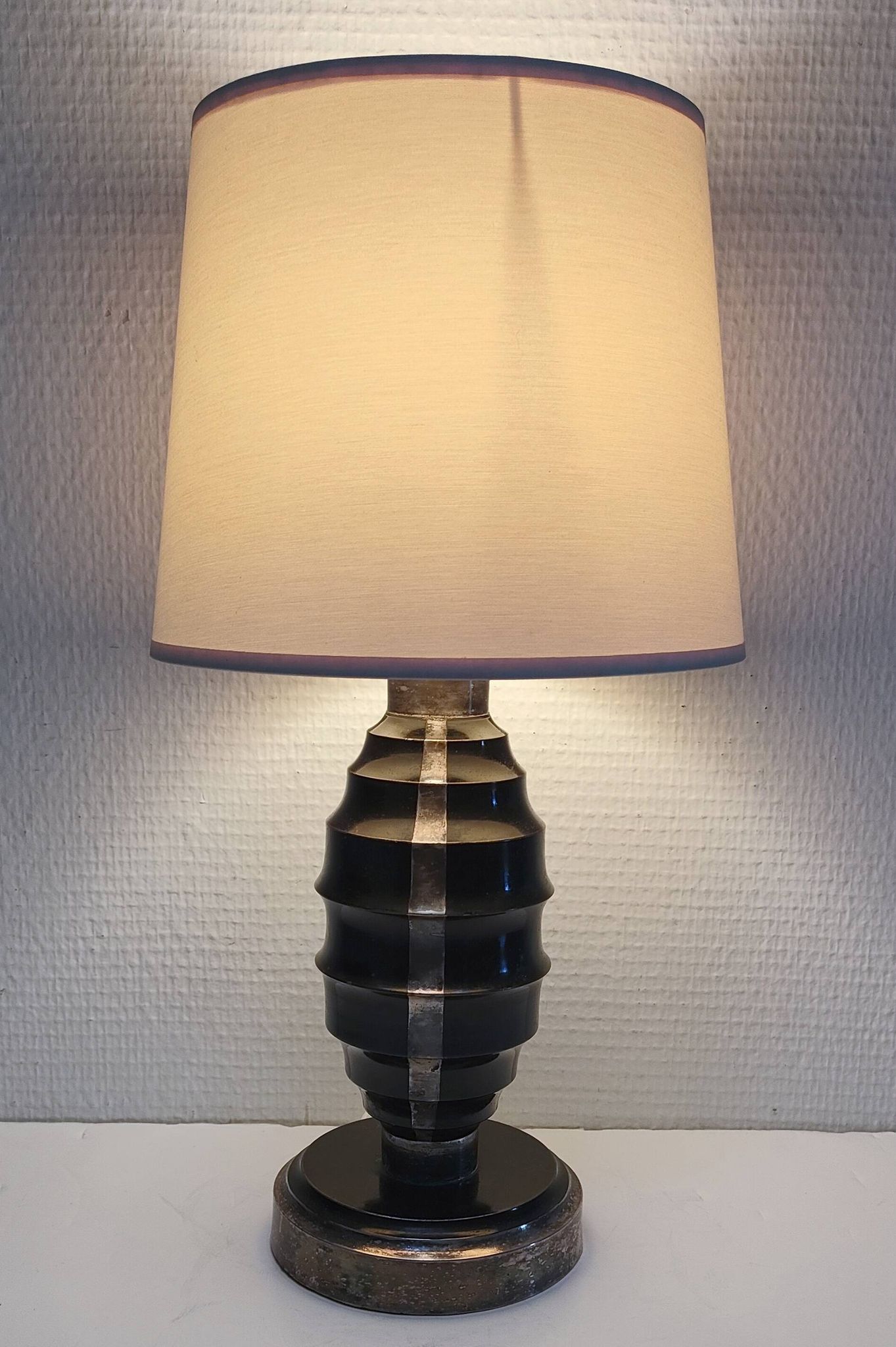 Art Deco metal lamp base with black and silver patina