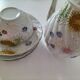 coffee pot, cup and saucers
