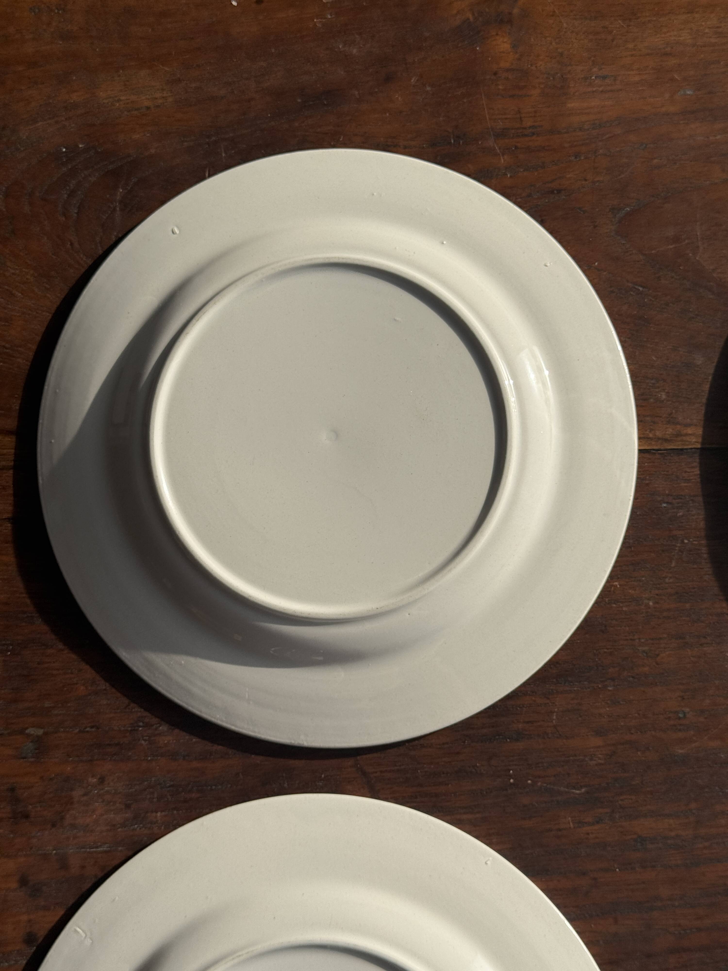 Set of 4 small dessert plates with a vintage stylised flower pattern.