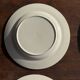 Set of 4 small dessert plates with a vintage stylised flower pattern.