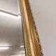 XL vintage bevelled mirror with a gold frame.