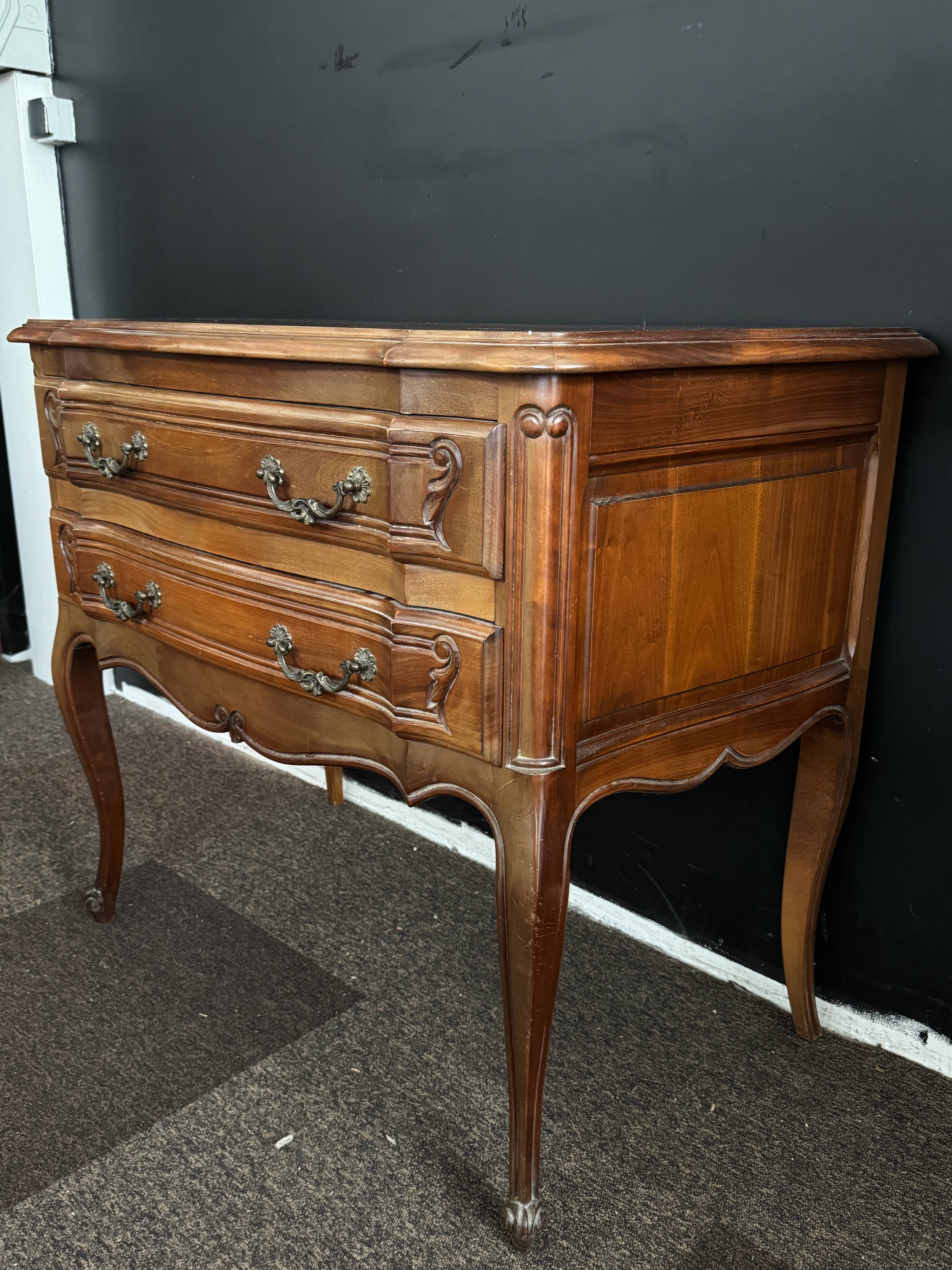 Carved wooden chest of drawers