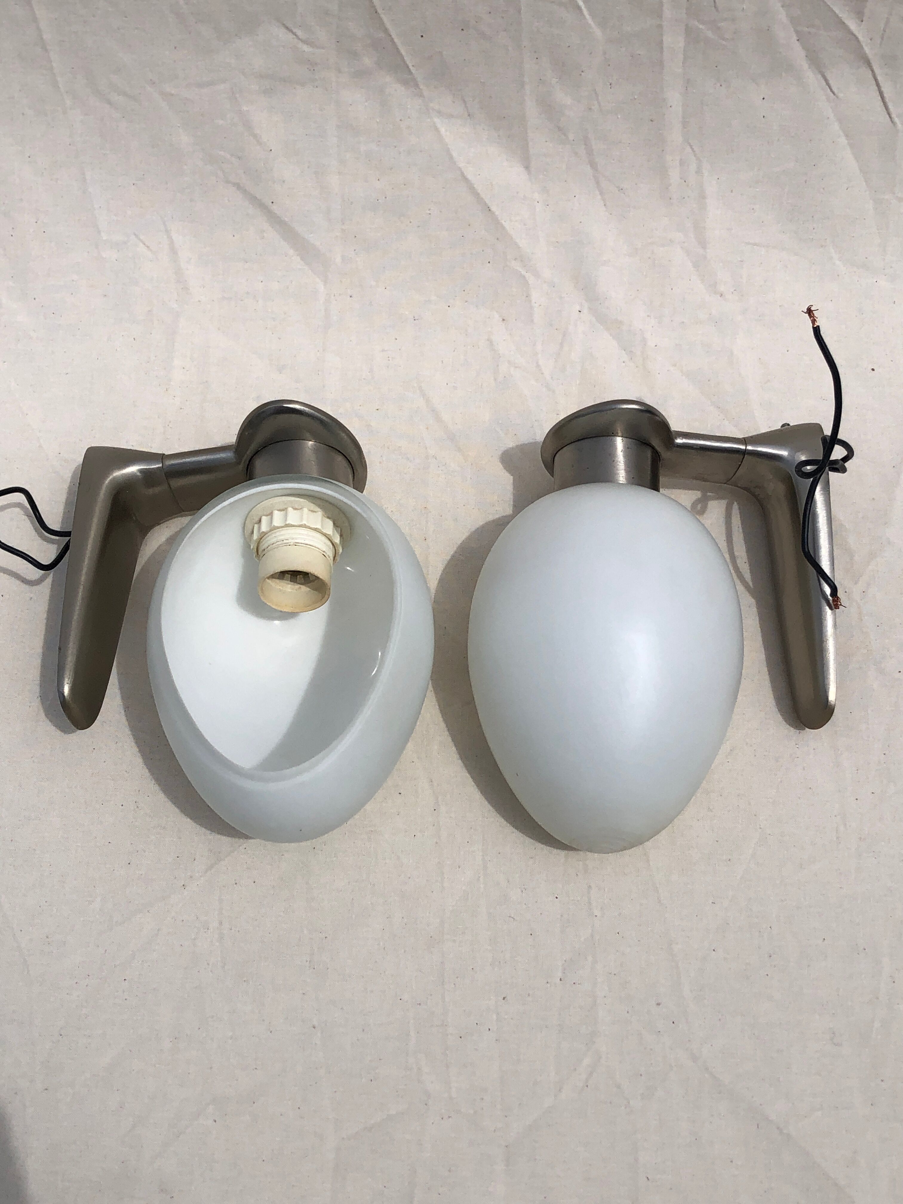 Pair of brushed steel appliques, half-egg opaline, 1970