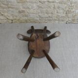 Brutalist chair in carved solid wood, around 1950.