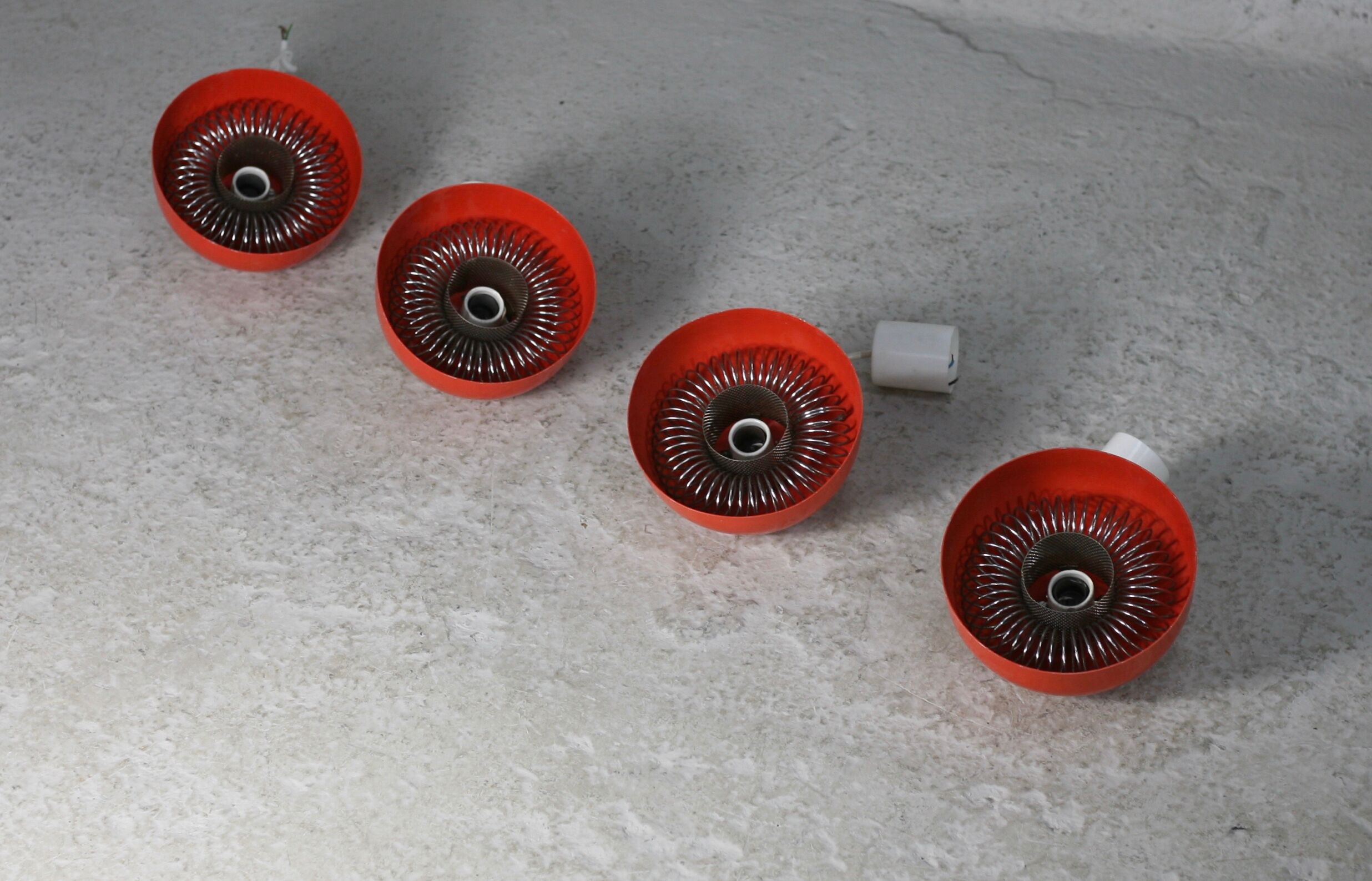 Set of 4 "spring" hanging lamps, orange steel, France, circa 1970
