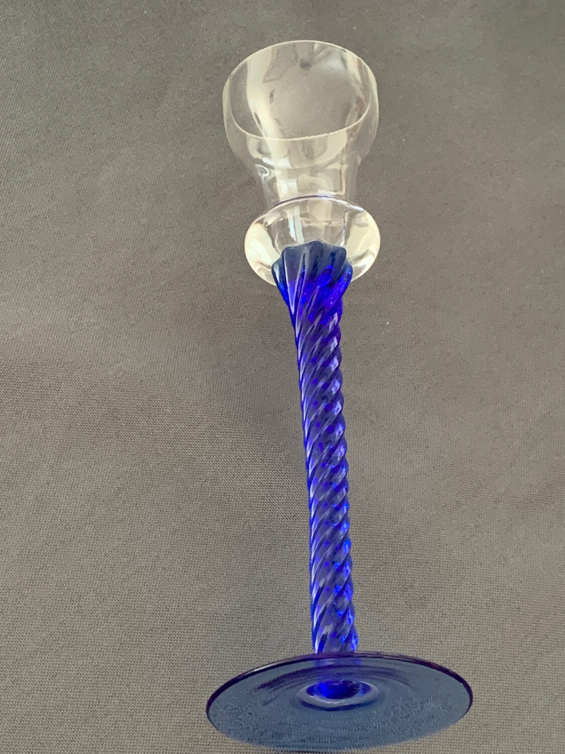 Blue glass candle holder with twisted stem. Candlestick candle