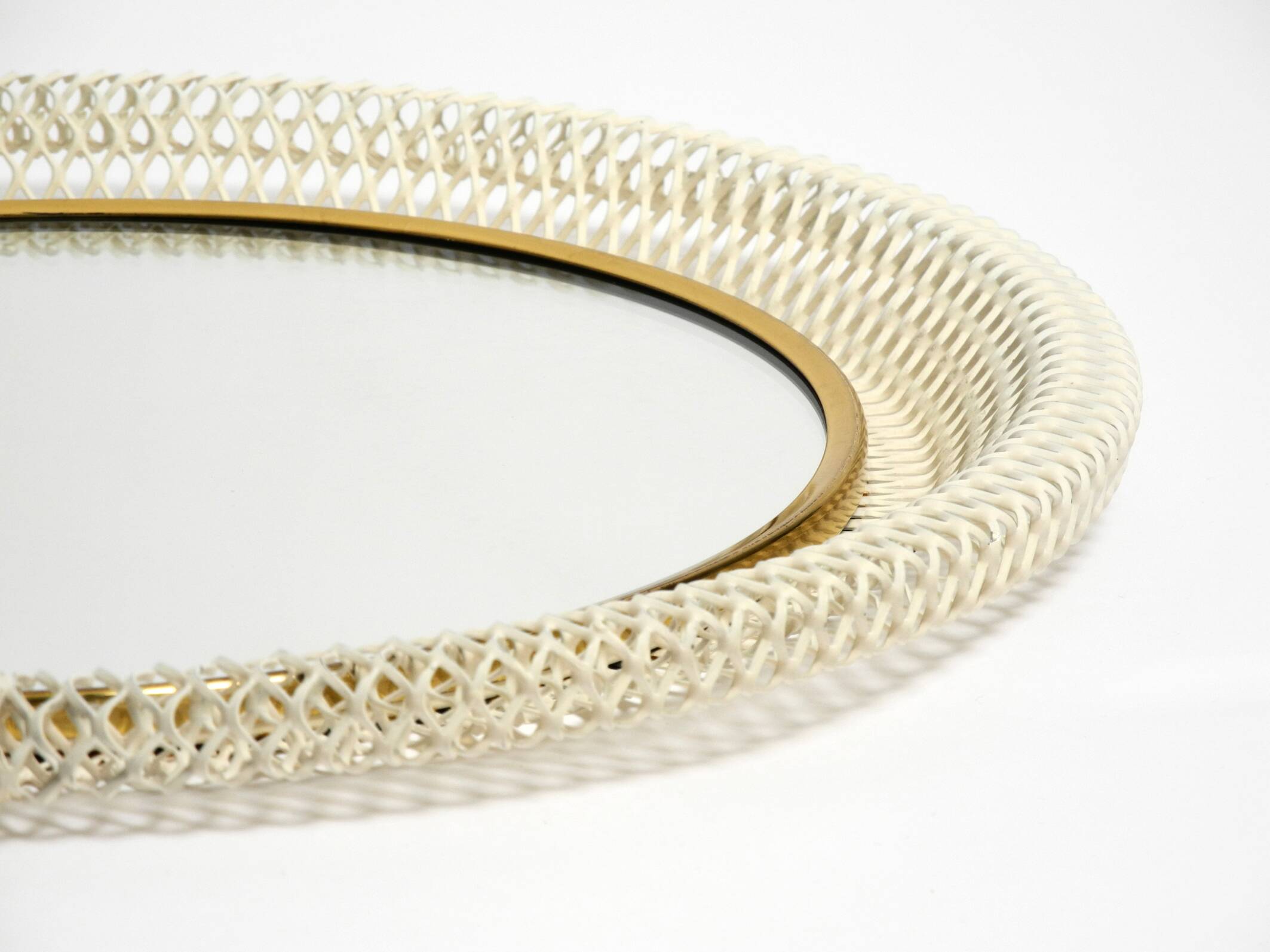 Pair of Mid Century wall mirrors with brass rim and white metal frames