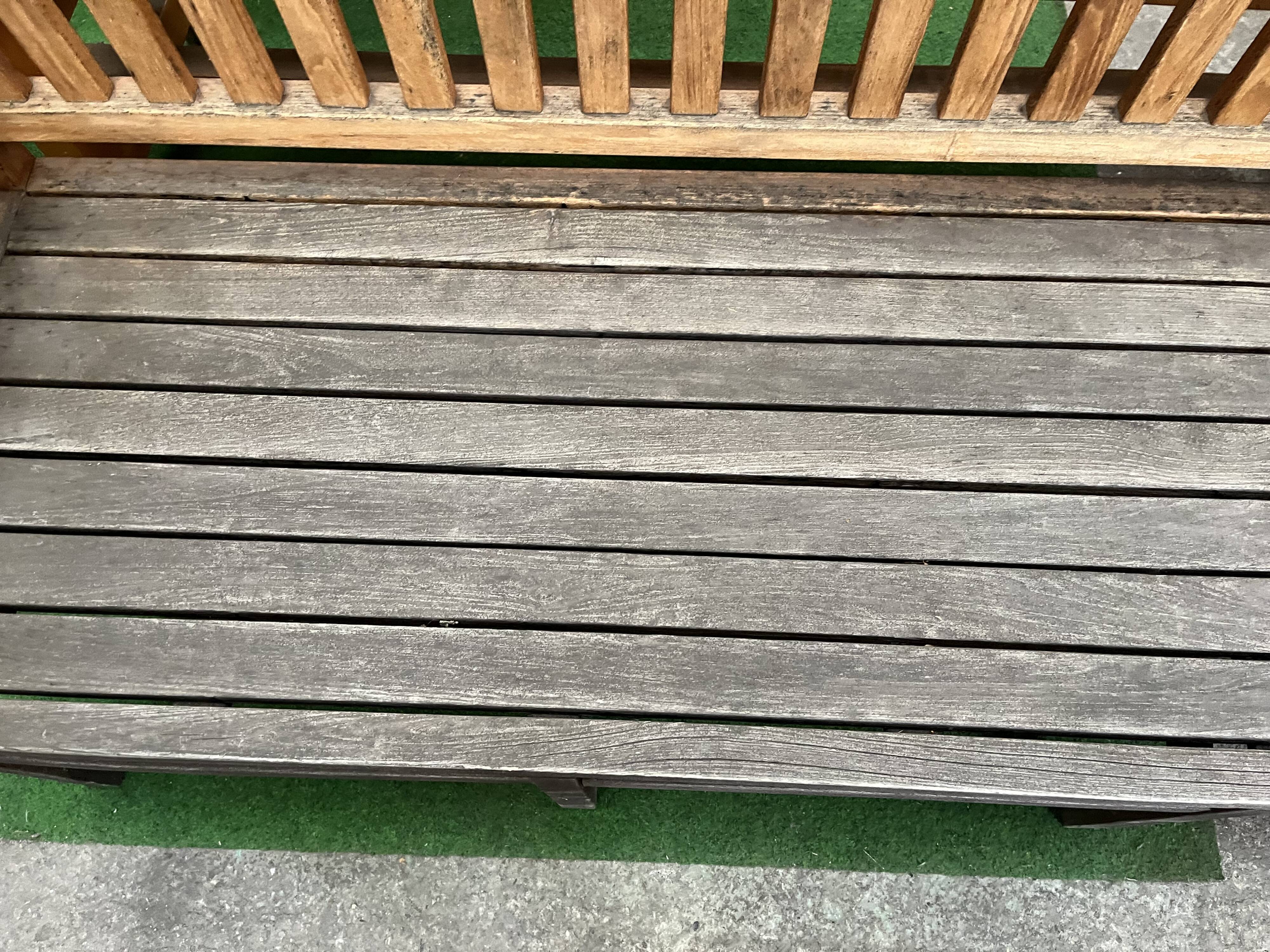 Colonial-style teak bench