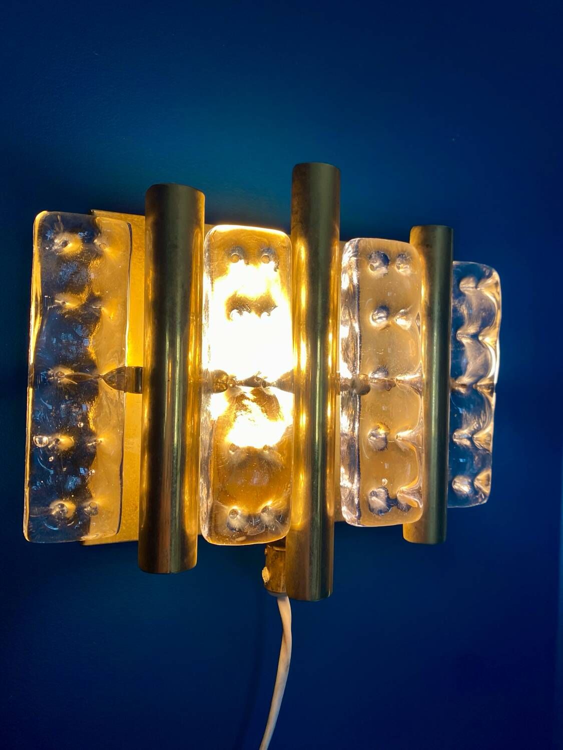 HANS AGNE JAKOBSSON. A pair of glass and brass wall lights