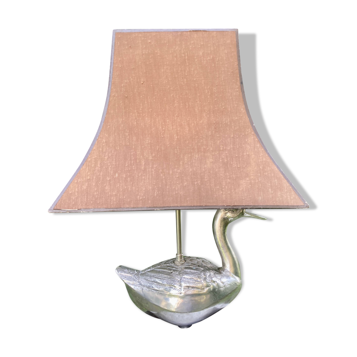 Old vintage lamp representing a duck in silver metal with wooden base