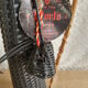 Glass bottle covered with black scoubidou with twisted golden handle - vintage