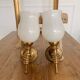 Set of 2 golden, bronze and brass torch wall lights
