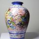 Vintage Portuguese vase in glazed terracotta with hand-painted floral decoration.