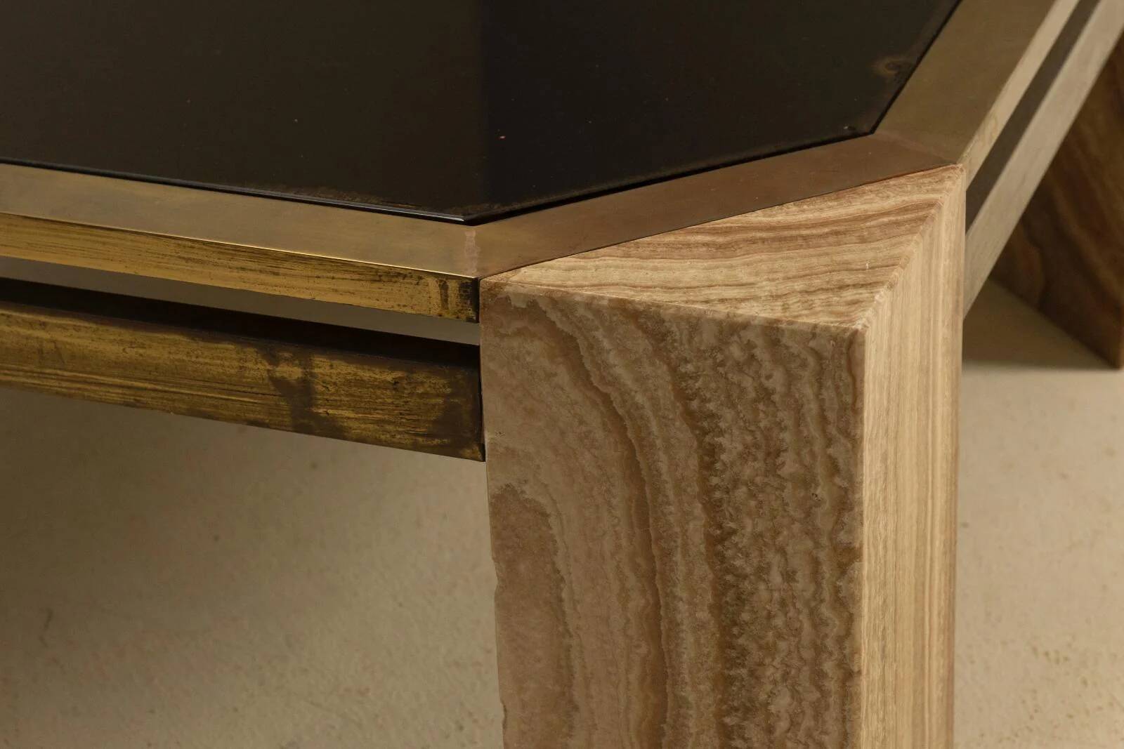 Stone and brass coffee table, 1970s, Italy.