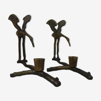 Pair of old crane candle holders on a bronze branch