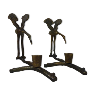 Pair of old crane candle holders on a bronze branch