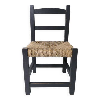 Old small straw chair for a child
