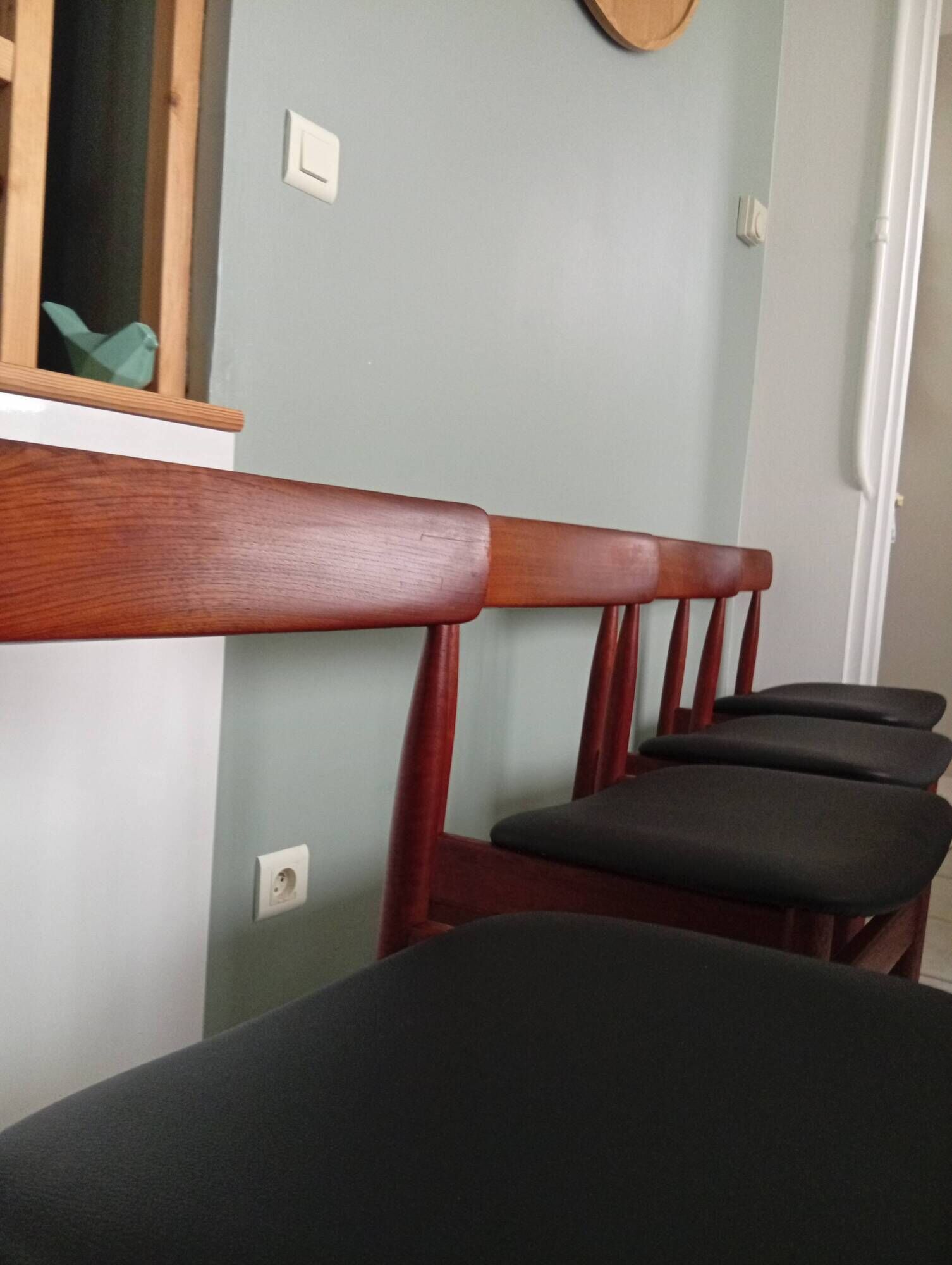 Four Danish mid-century teak armchairs.