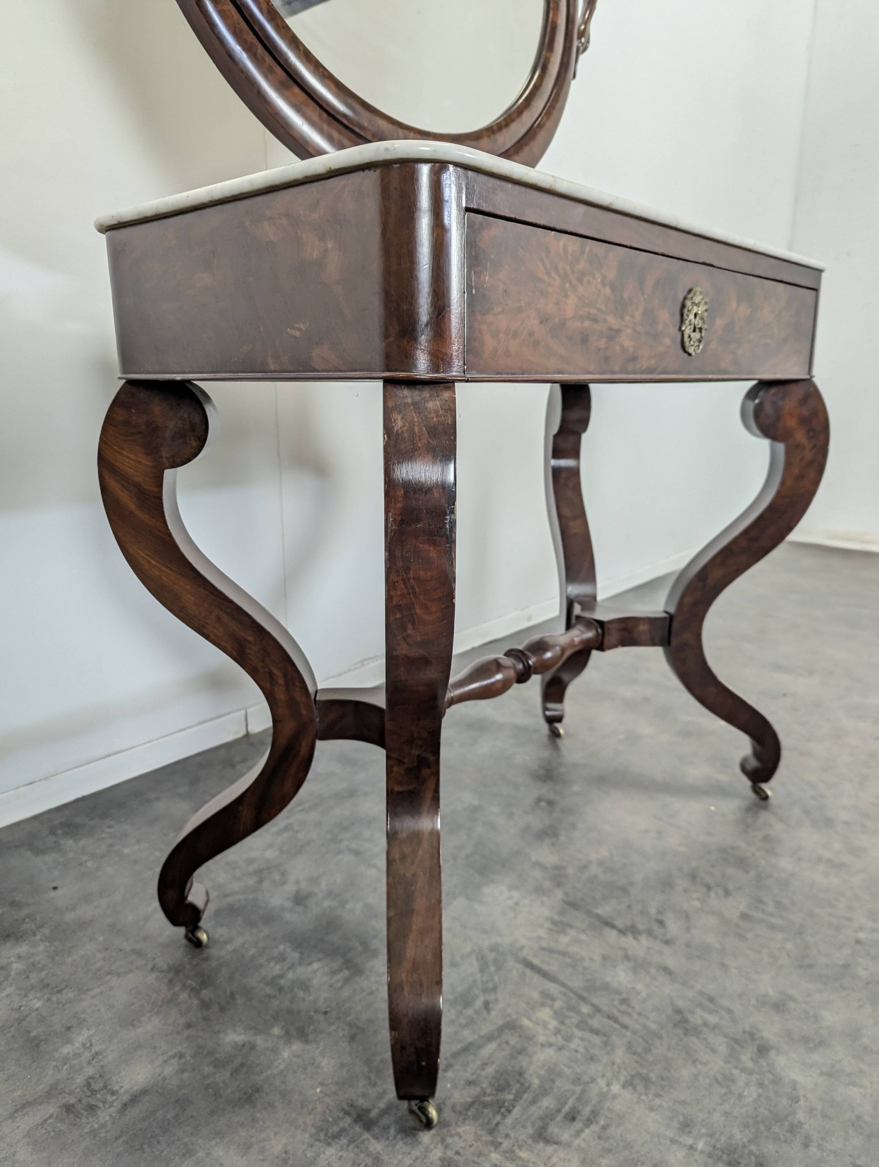 Restoration period flamed mahogany swan neck dressing table