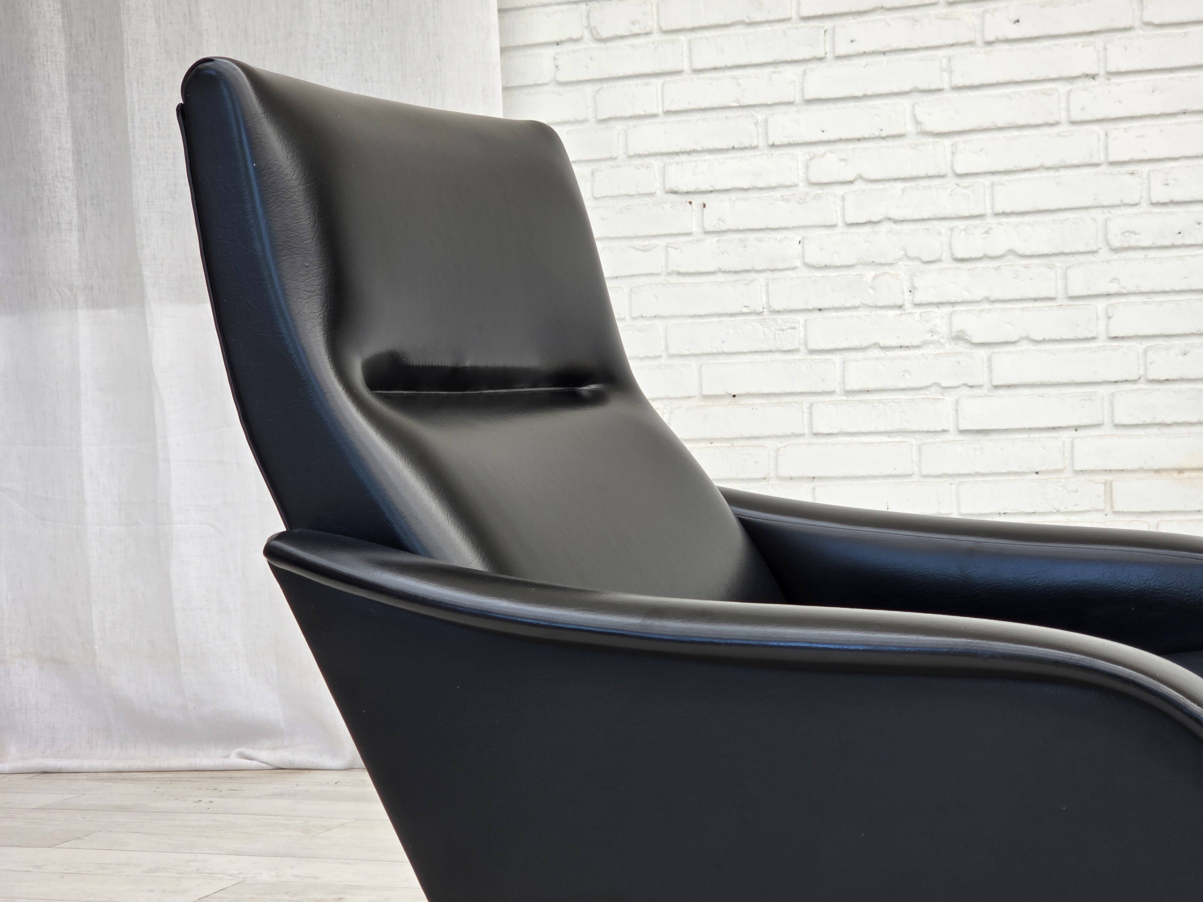 1970s, Danish armchair, black artificial leather, teak wood legs.