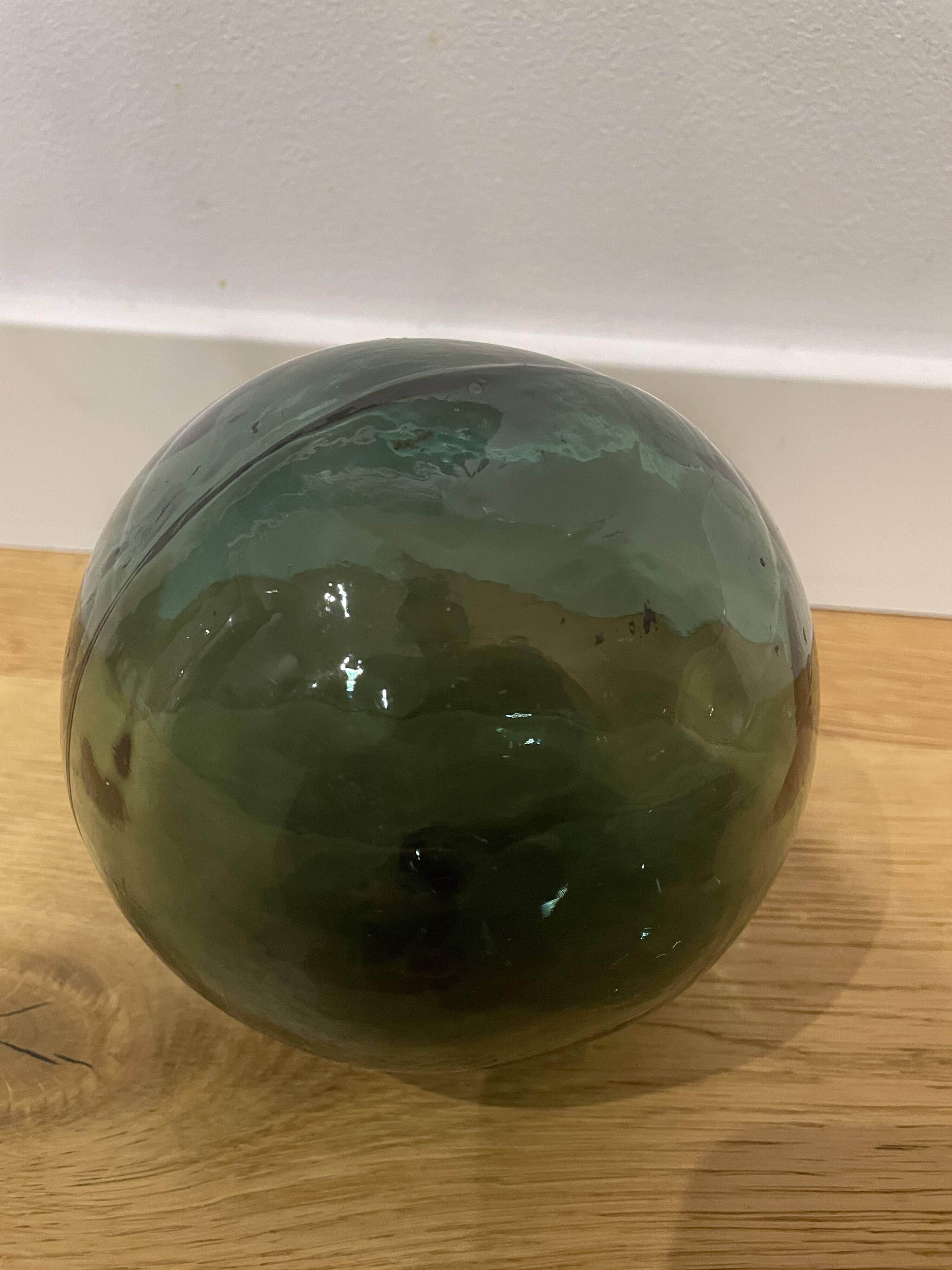 Floating fishing ball in glass