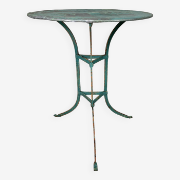 Iron garden table with round top on 3 legs