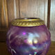 Antique iridescent purple glass lantern with a brass frame.