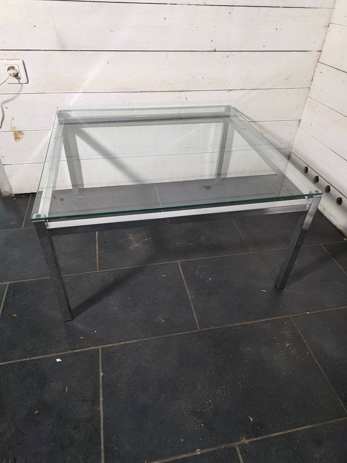 Chrome metal coffee table with a glass top from the 1970s.