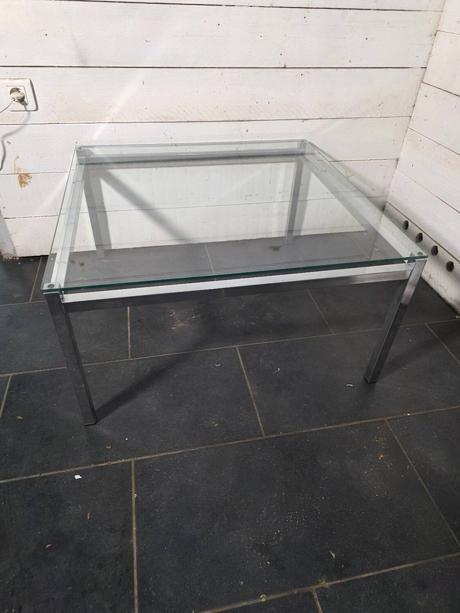 Chrome metal coffee table with a glass top from the 1970s.