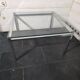 Chrome metal coffee table with a glass top from the 1970s.