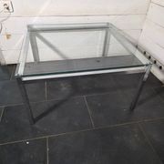 Chrome metal coffee table with a glass top from the 1970s.
