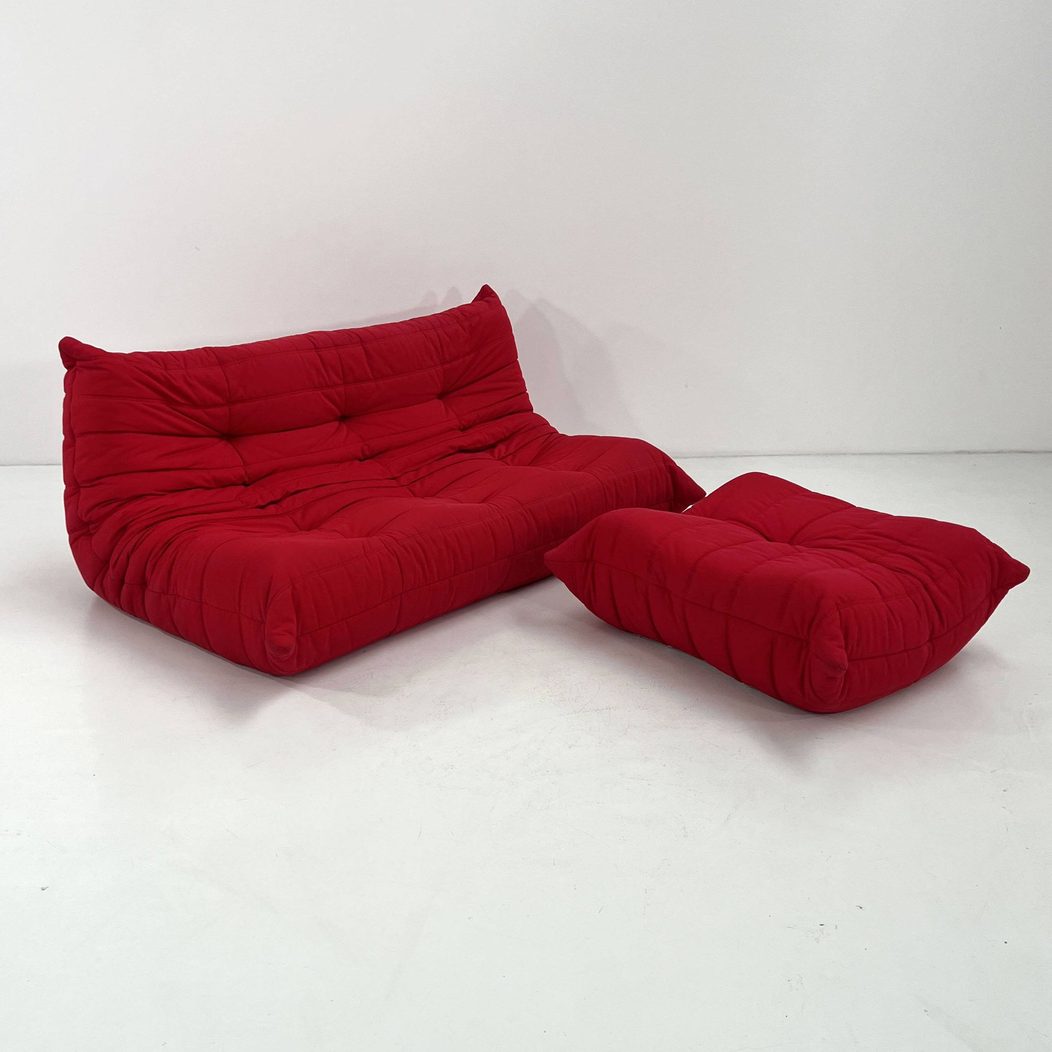 Togo 3-seater with red ottoman by Michel Ducaroy for Ligne Roset, 1970.