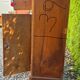 Antique wooden bedside table with marble