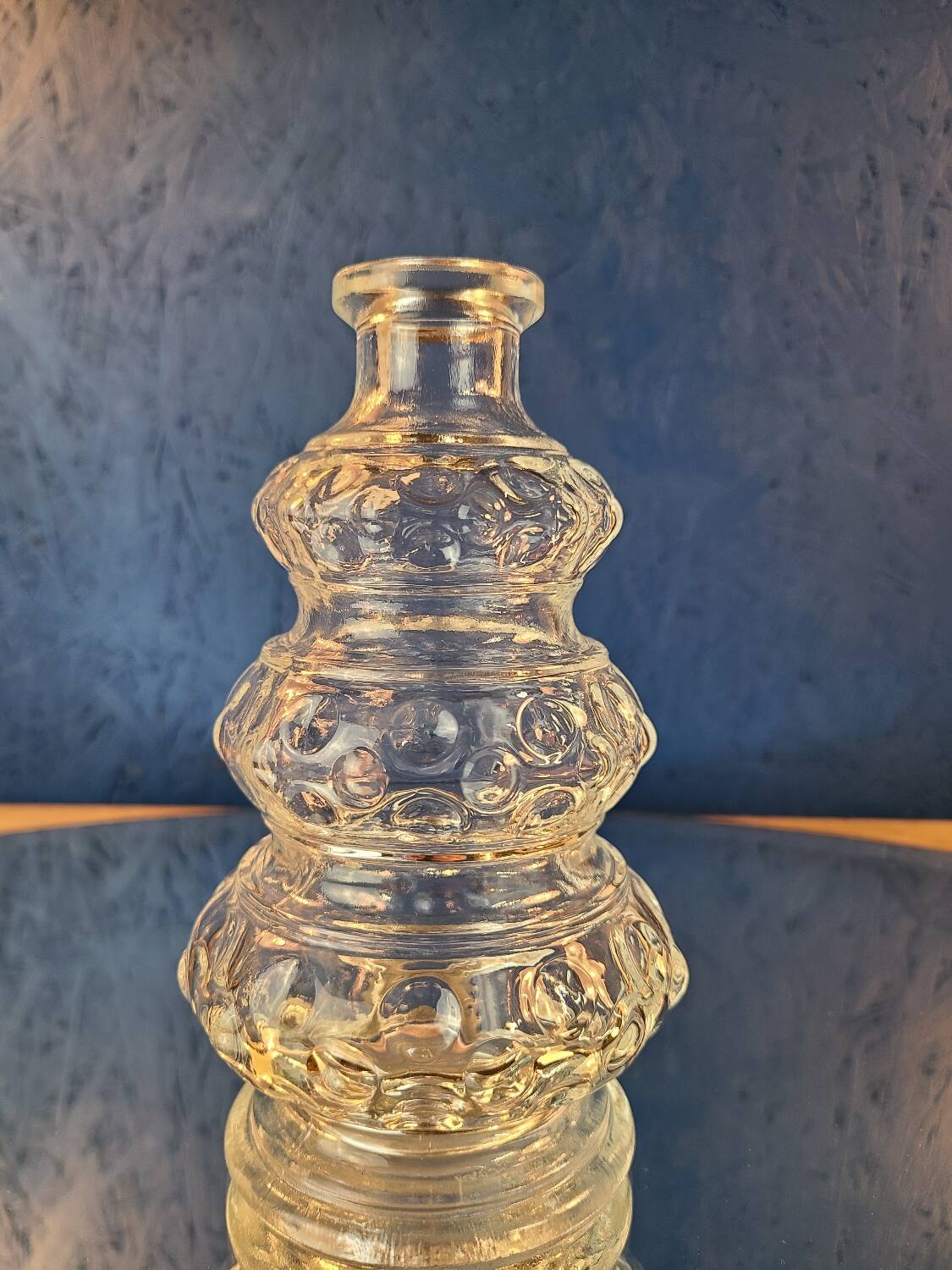 Old 3-branched stone candlestick cut with fine engravings