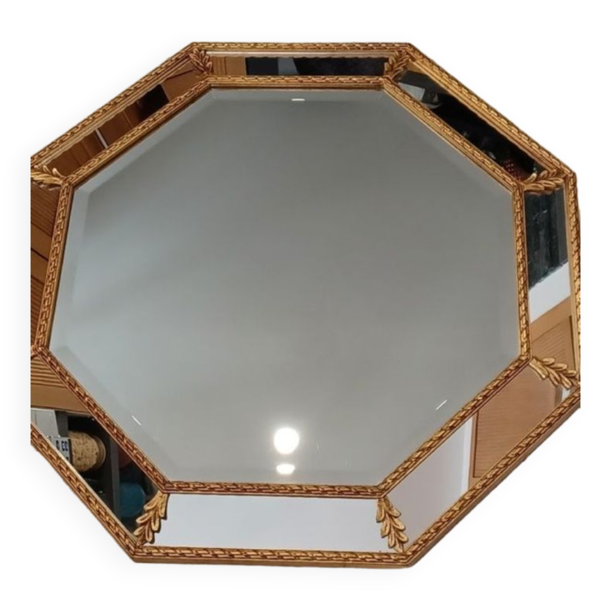 Octagonal mirror with golden wood frame