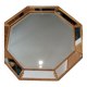 Octagonal mirror with golden wood frame