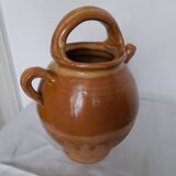 Old enameled ceramic pitcher