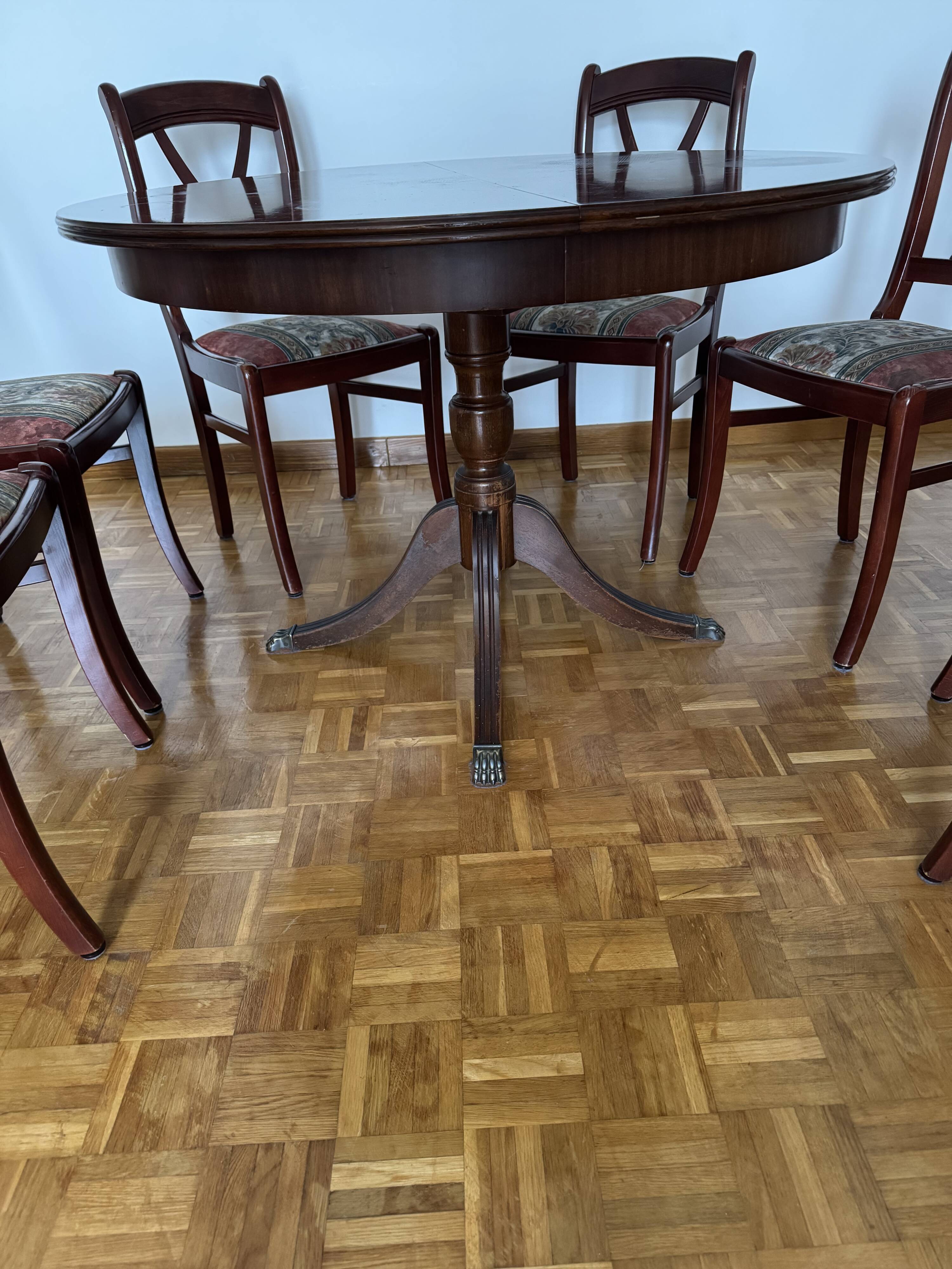 Round mahogany table and beech chairs.
